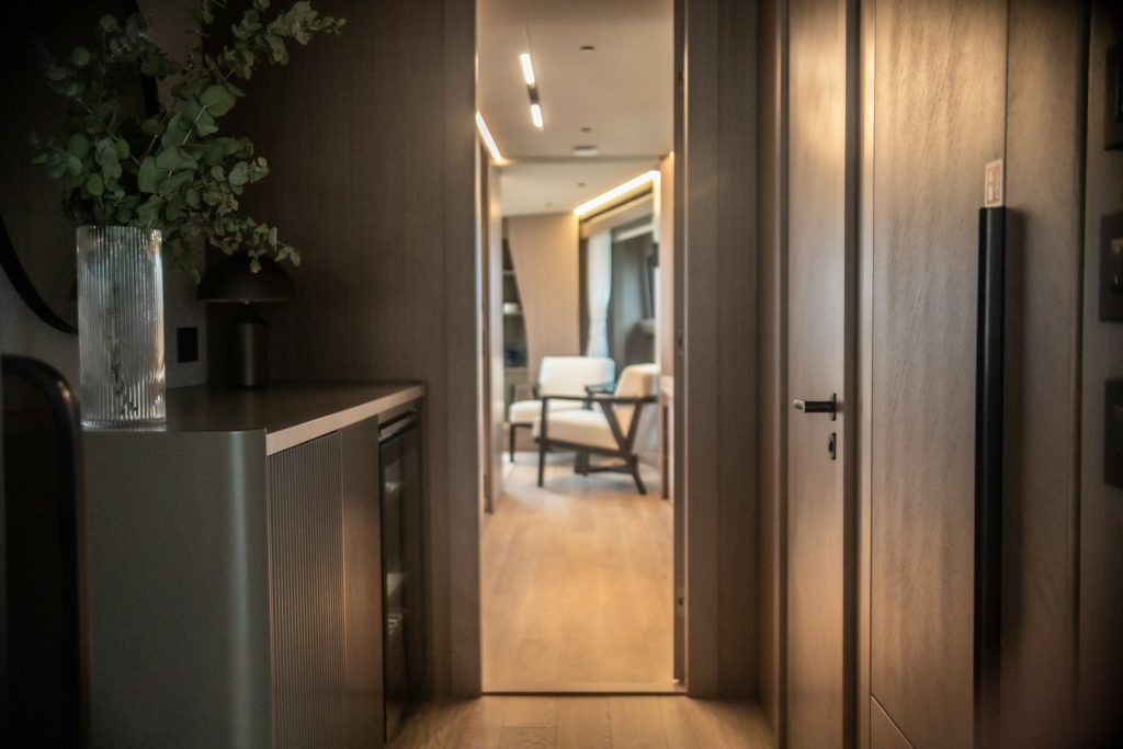 a hallway leading to a living room and dining room