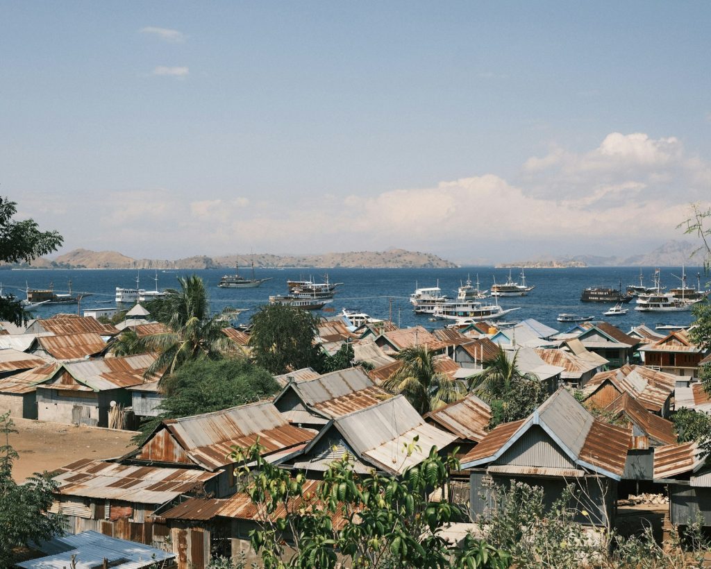 A group of boats floating on top of a body of water
